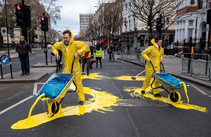 Activist group painted road in front of Russian embassy in Ukrainian colours in London today
